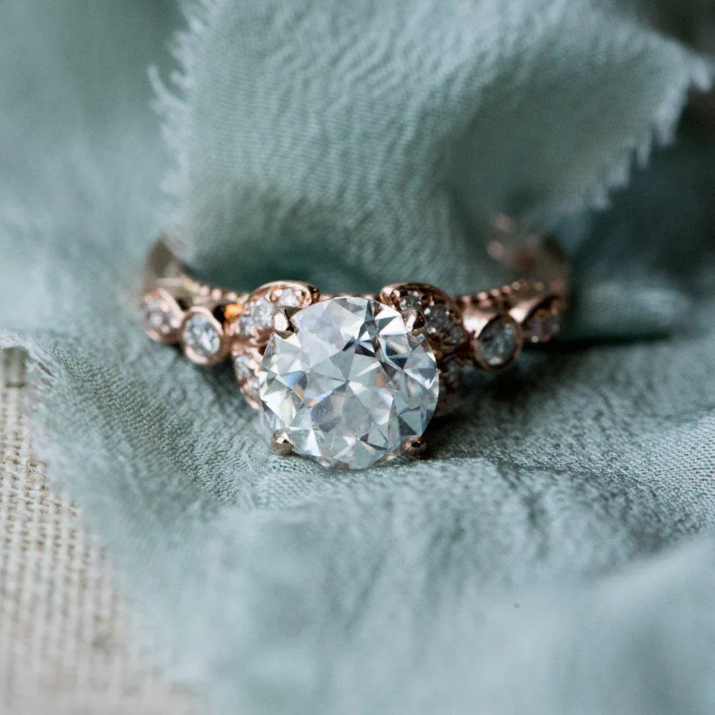 8mm Round OEC Heirloom Moissanite 14K Rose Gold Half Bead Shank and Diamond Bezel Side Ring