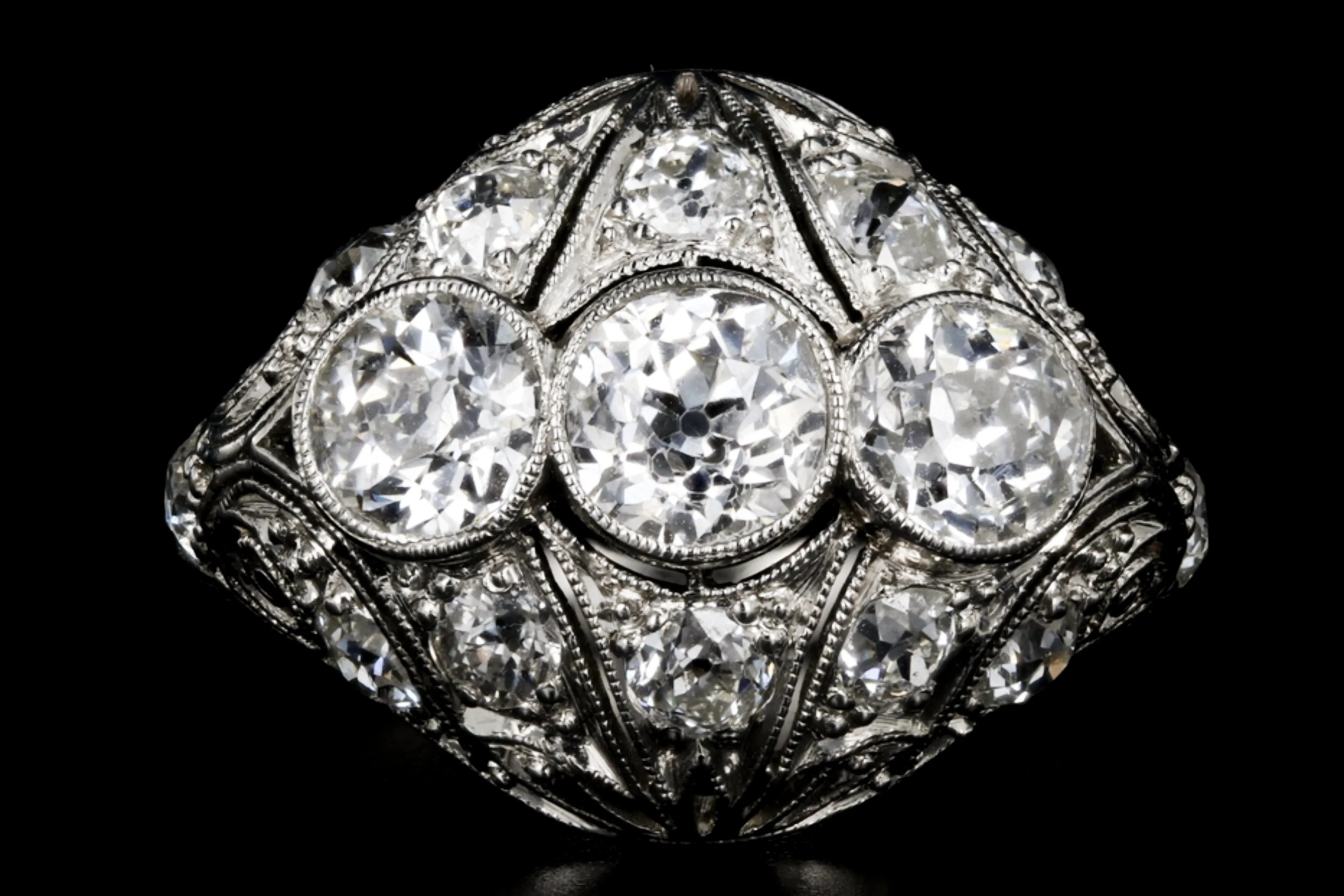 Art Deco Platinum 2.53 Carat Total Weight Three Stone Diamond Ring