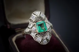 EMERALD AND DIAMOND NAVETTE SHAPE RING