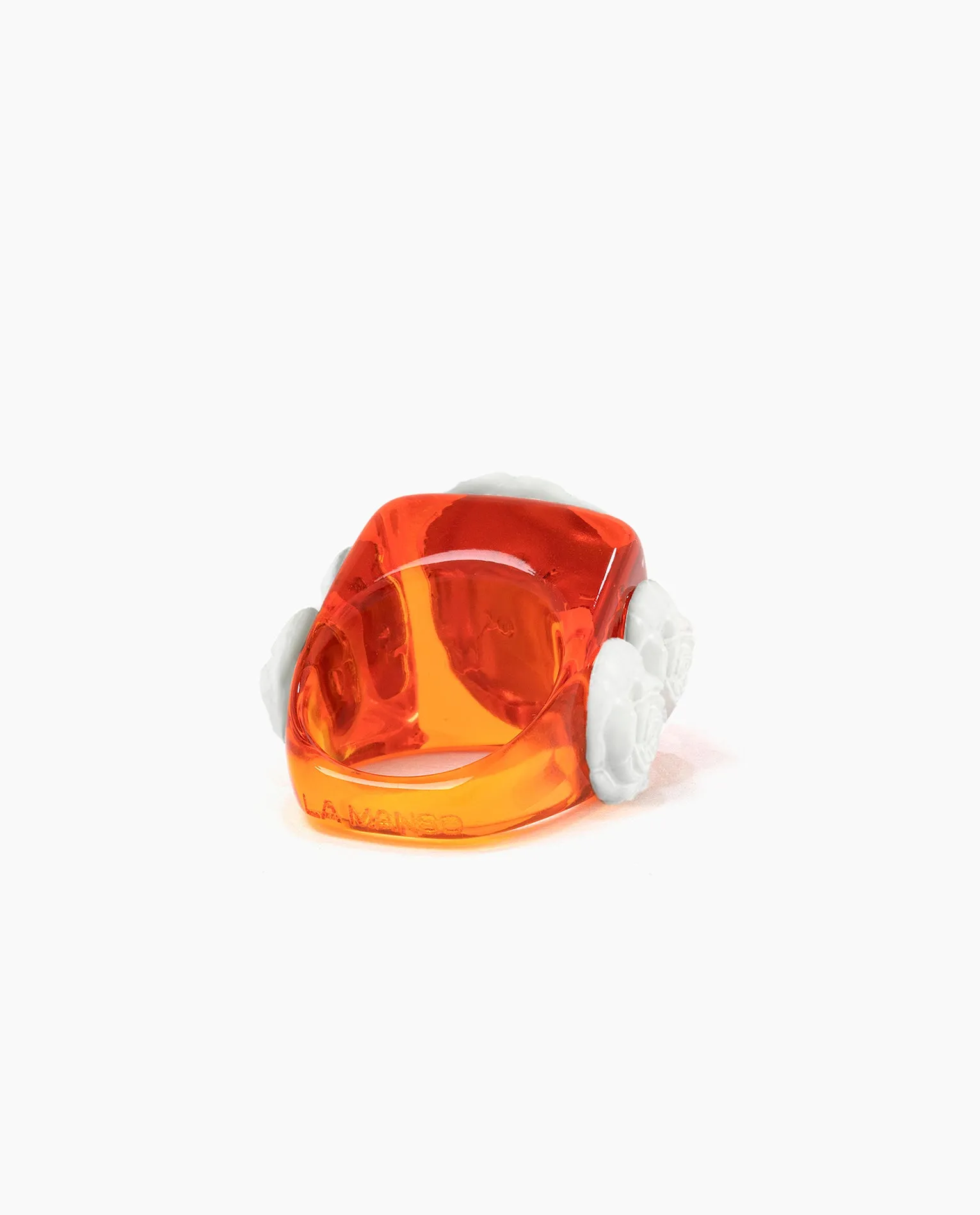 Orange crystal on White Rosetón