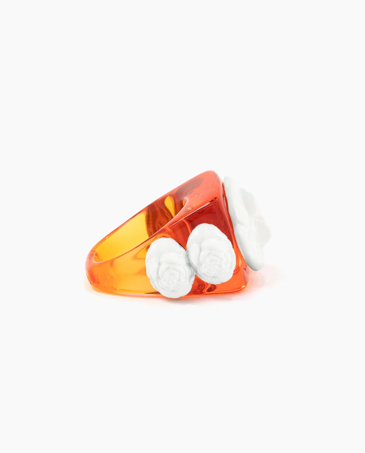 Orange crystal on White Rosetón